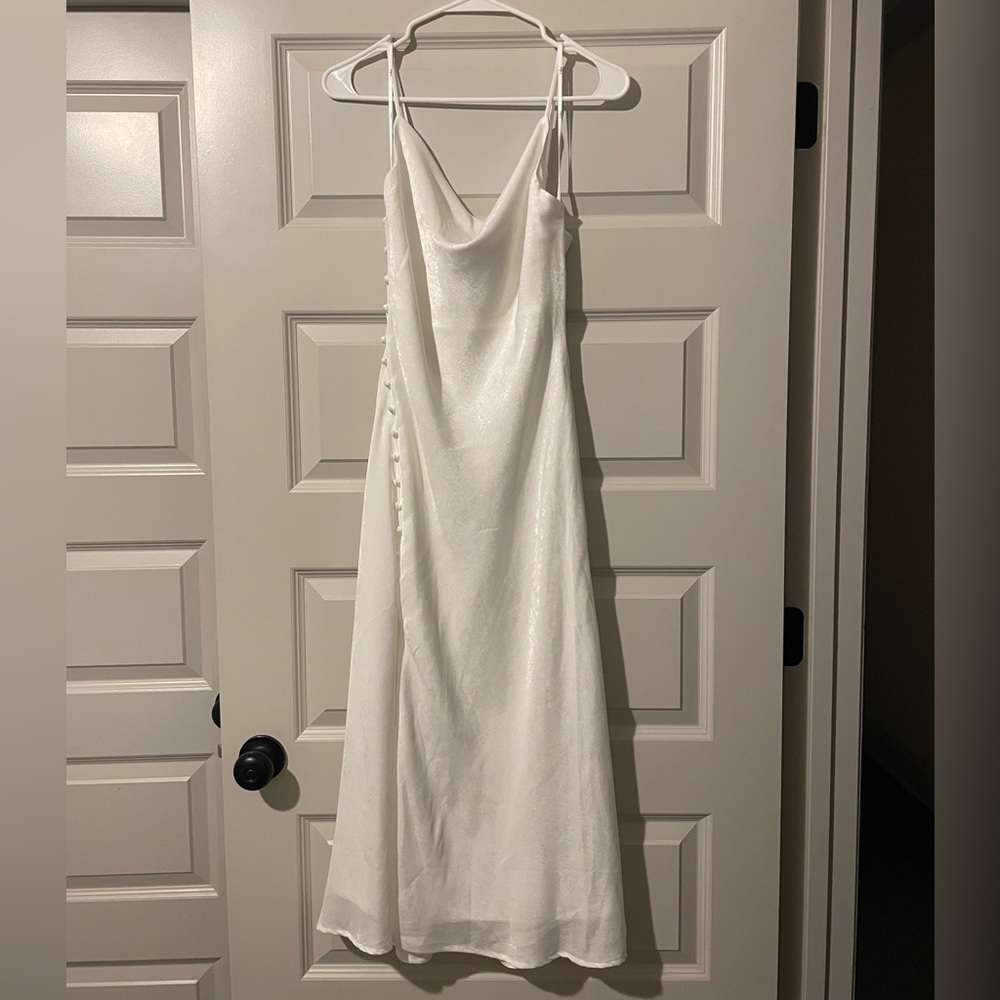 Lulu’s white satin dress. Buttons on left side along slit. Scoop neckline.